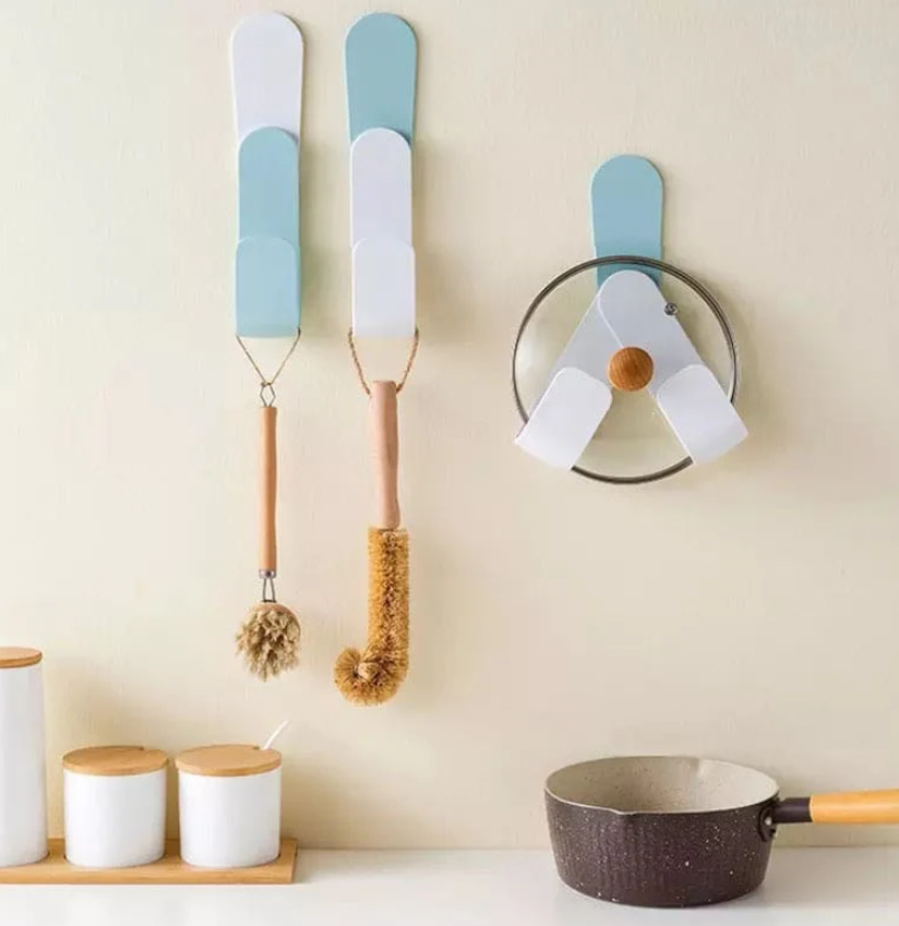 ADJUSTABLE POT LID HOLDER FOR WALL